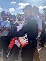 Israeli police after confiscating Palestinian flags and posters, Al-Haq © 14 May 2018, Jerusalem
