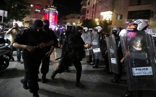 Palestinian Police and masked security forces near Clock Square, Ramallah, 13 June 2018.