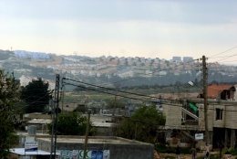 Bilin village with Modi'in settlement in the background (West Ramallah). Photo: Bassam Almohor
